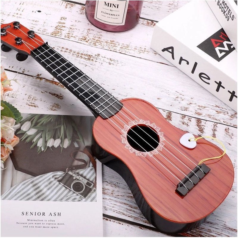 Jouet De Guitare Simulation De Musique Pour Enfants Instrument De Guitare Mini Quatre Cordes Pouvant Être Jouées Pour L'éducation Précoce