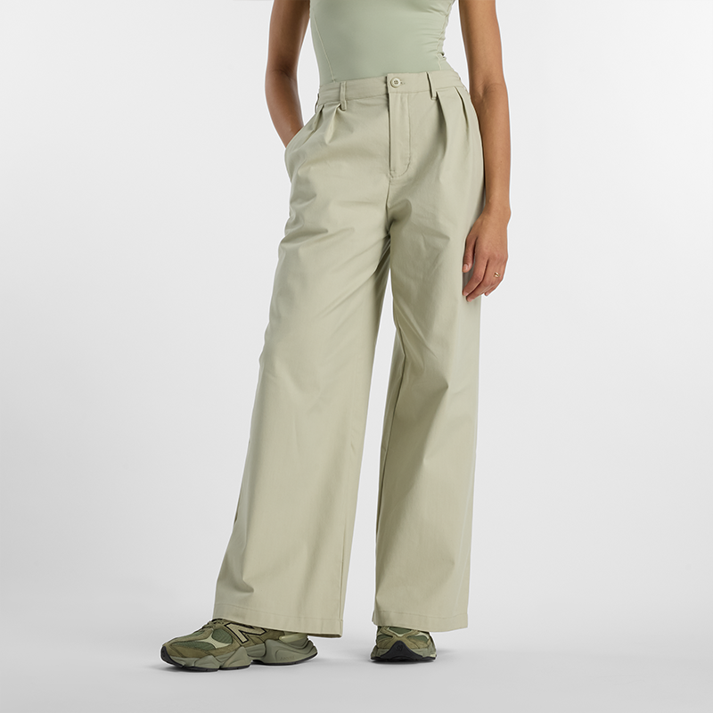 Levně Dámské kalhoty New Balance WP51538OVN – béžové