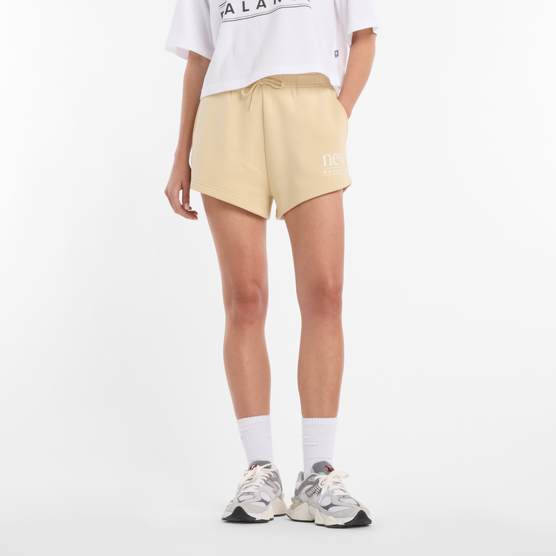 Levně Dámské šortky New Balance WB61Y80AABC – žluté