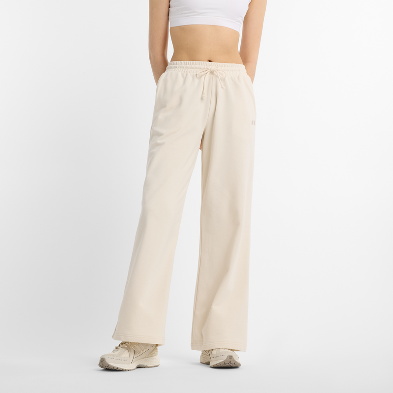 Levně Dámské kalhoty New Balance WP51503LIN – béžové