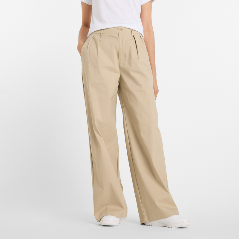 Levně Dámské kalhoty New Balance WP51538SOT – béžové