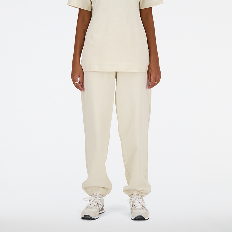Levně Dámské kalhoty New Balance WP41513LIN – béžové