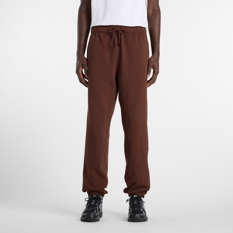Levně Pánské kalhoty New Balance MP41508ABJ – hnědý