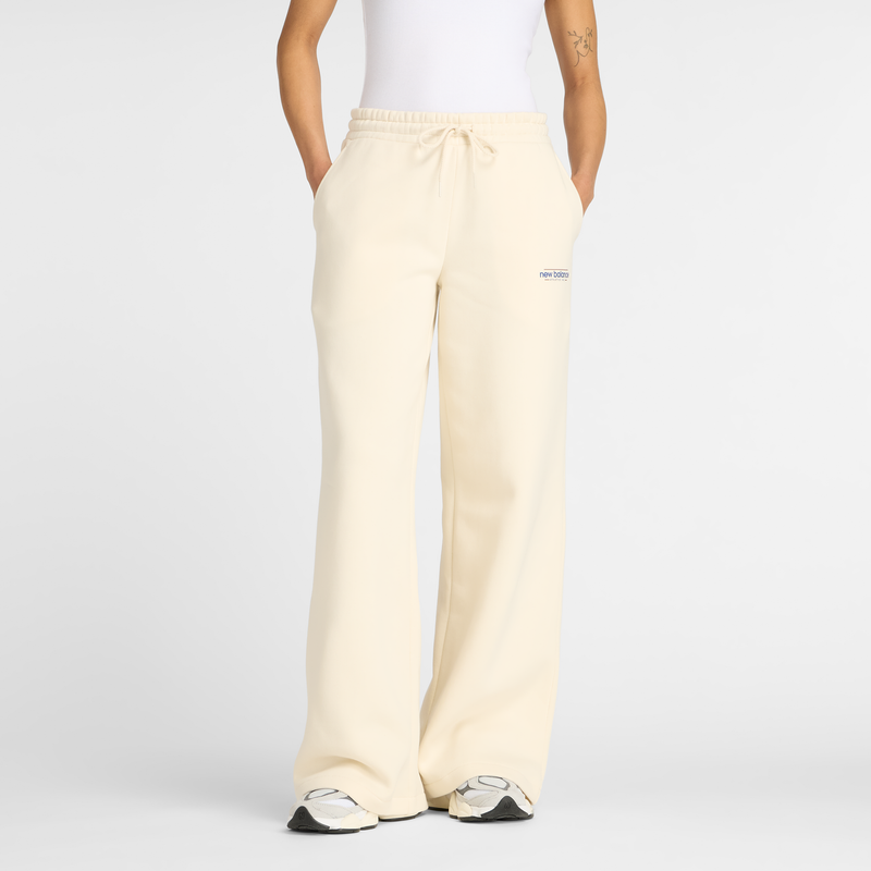 Levně Dámské kalhoty New Balance WP53903LIN – béžové
