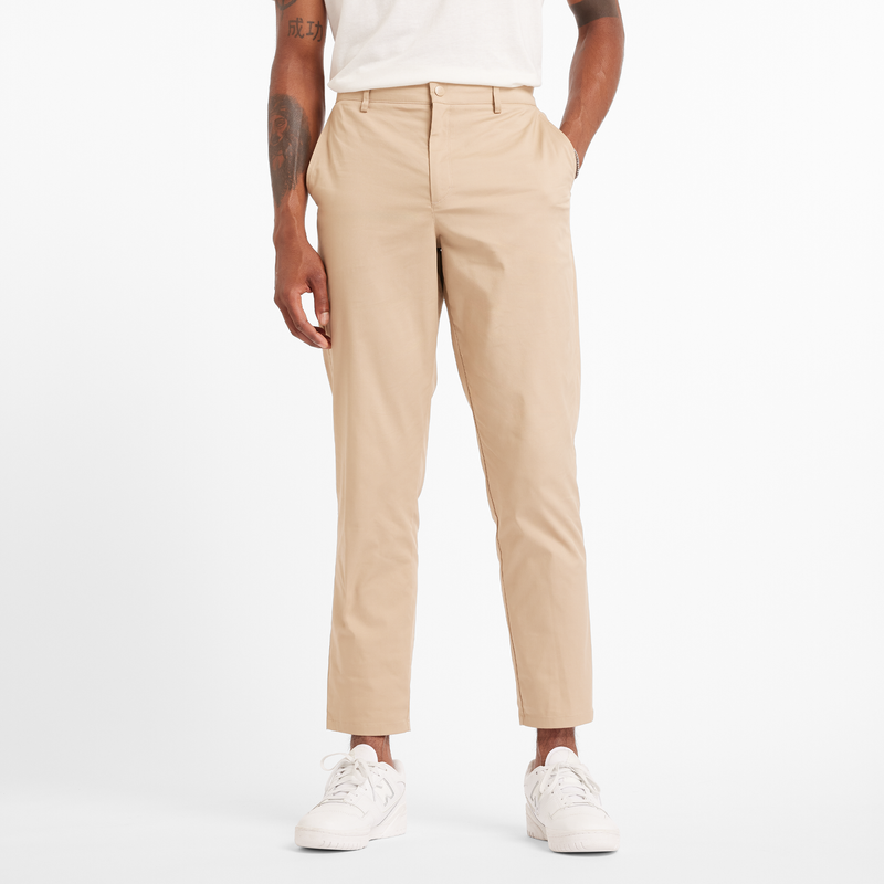 Levně Pánské kalhoty New Balance MP43554SOT – béžové