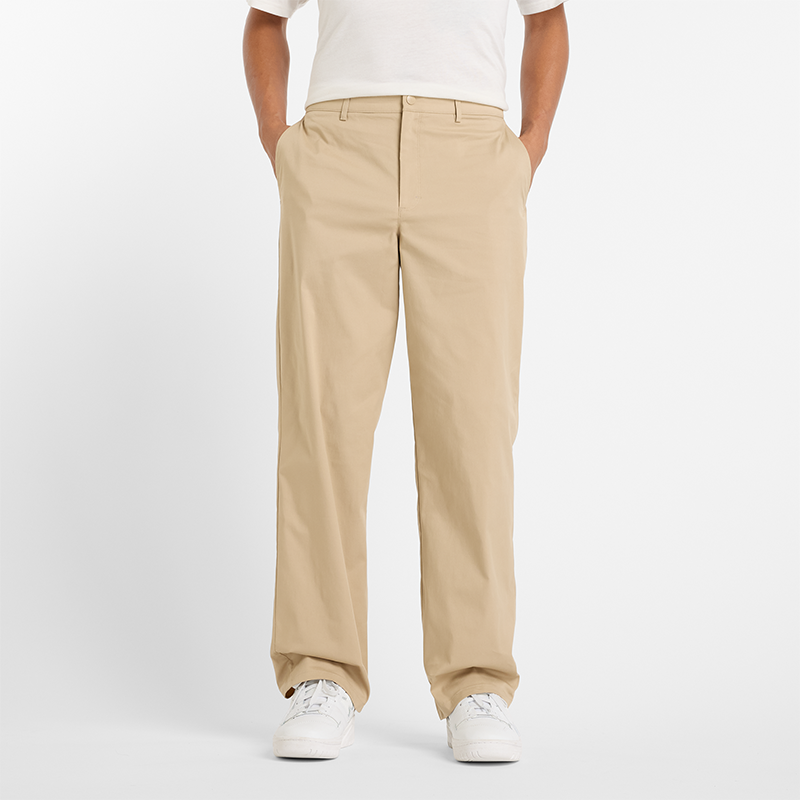 Levně Pánské kalhoty New Balance MP43560SOT – béžové
