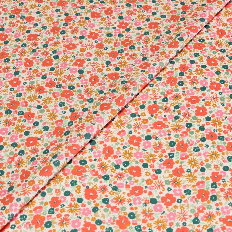 Percale 100% coton peigné luxe - Petites fleurs multicolores fond rose clair